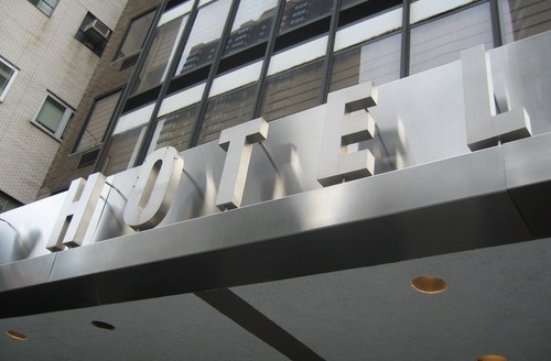 Hotel Technology Rentals A sign above a doorway indicating that the building is a hotel