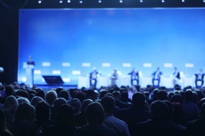 Corporate Event Rentals Presenters on stage in front of a crowd