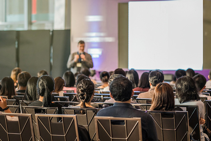 Event Projector Rentals a individual giving a presentation in a classroom like setting