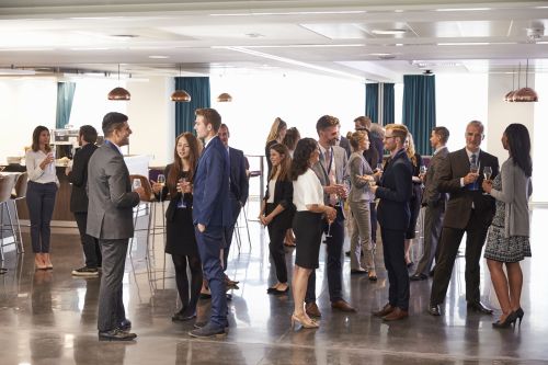 Non-Profit & Fundraising Event Rentals Business people networking in a lobby