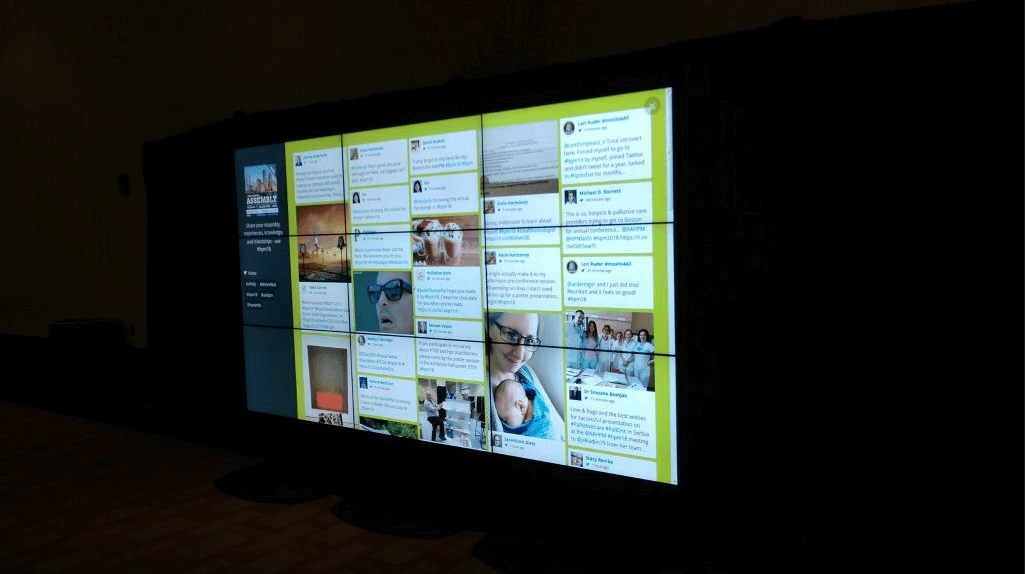Video Wall Rentals A video wall composing of 9 total screens being used as a social media wall, displaying various social media posts