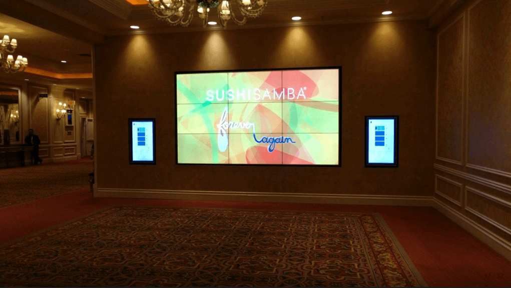 Video Wall Rentals from Rentacomputer.com A mounted 3x3 video wall disaplying a company's logo