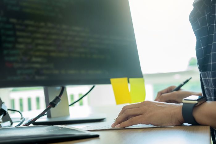 Man Coding Reliable Software For The Kiosk Event Engagement Services